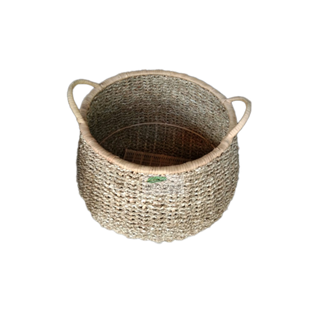 Round Sea Grass rattan basket with metal construction.    